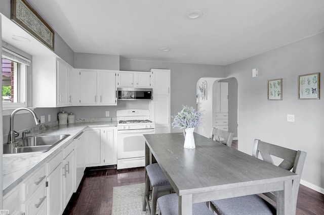 30 Connecticut St, Marysville, MI 48040 - kitchen with white appliances, a sink, white cabinetry, dark wood finished floors, and recessed lighting