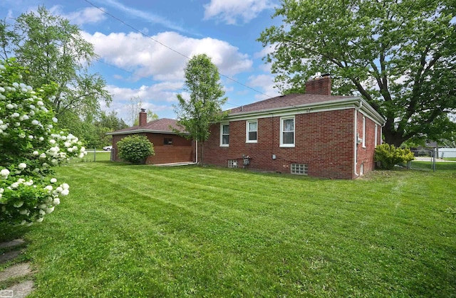 30 Connecticut St, Marysville, MI 48040 - rear view of house with a chimney and brick siding