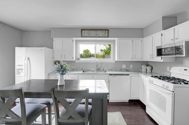 30 Connecticut St, Marysville, MI 48040 - kitchen featuring white appliances, a sink, white cabinets, and dark wood-style flooring