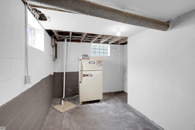 30 Connecticut St, Marysville, MI 48040 - basement with freestanding refrigerator and concrete block wall