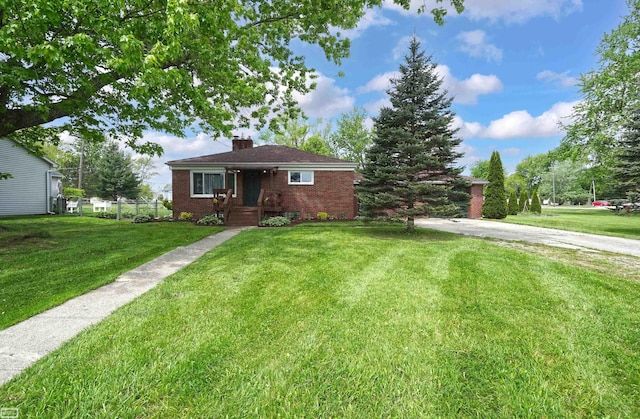 30 Connecticut St, Marysville, MI 48040 - view of front of property with brick siding, a chimney, and a front yard