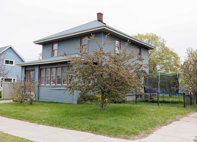 1302 N 3rd St, Ishpeming, MI 49849 - view of home's exterior featuring a trampoline and a chimney