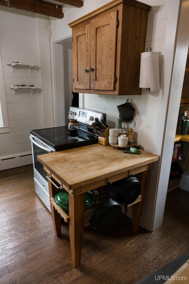 1302 N 3rd St, Ishpeming, MI 49849 - kitchen with electric range, wood counters, dark wood-style flooring, and beamed ceiling