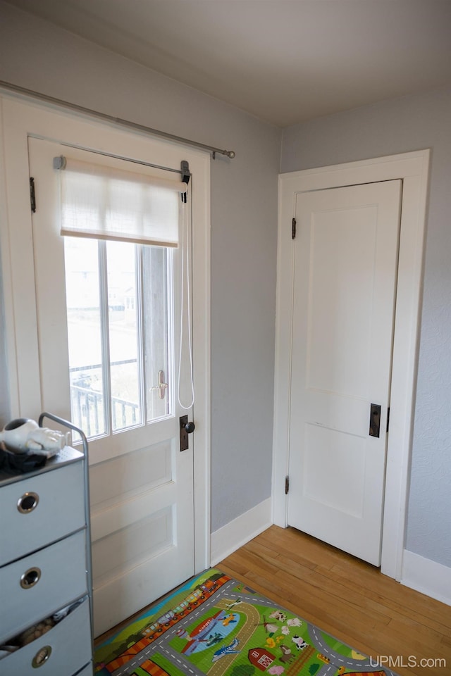 1302 N 3rd St, Ishpeming, MI 49849 - bedroom with light wood-style floors and baseboards