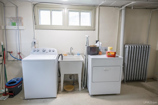 1302 N 3rd St, Ishpeming, MI 49849 - washroom featuring radiator and separate washer and dryer