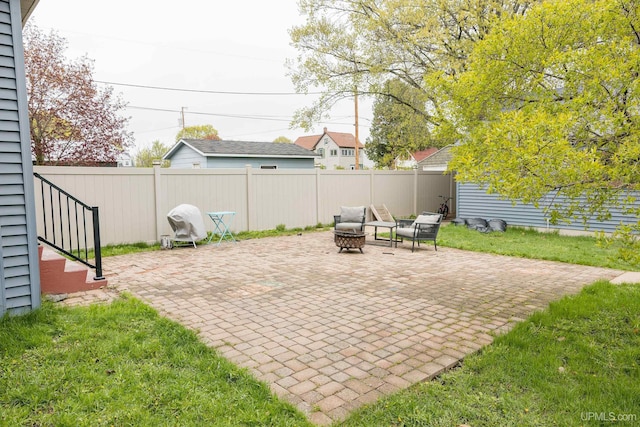 1302 N 3rd St, Ishpeming, MI 49849 - view of patio featuring a fire pit