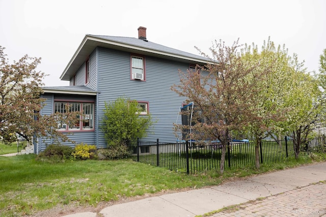 1302 N 3rd St, Ishpeming, MI 49849 - view of side of property with a chimney