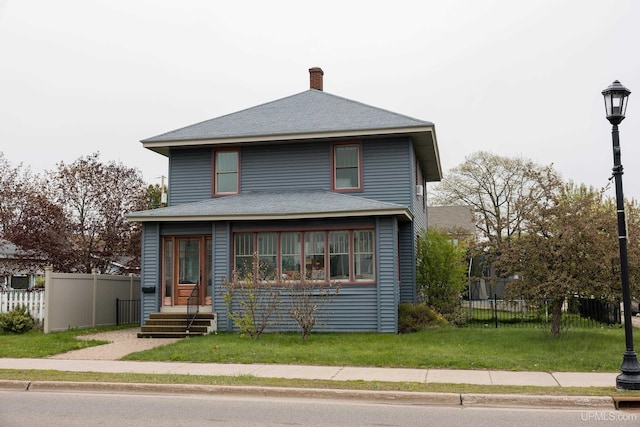 1302 N 3rd St, Ishpeming, MI 49849 - american foursquare style home with a chimney and a shingled roof