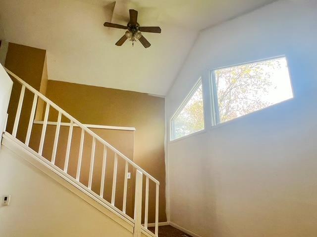 4815 Knollwood Dr, Harrison, MI 48625 - staircase featuring ceiling fan and lofted ceiling