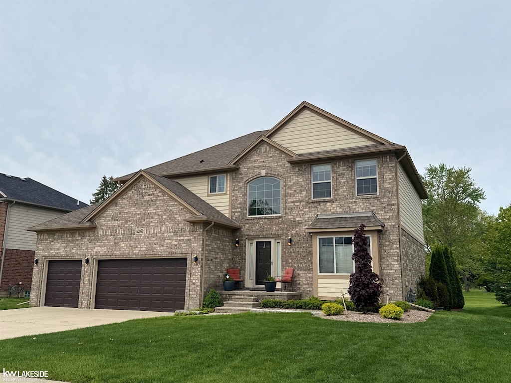 53989 Connor Dr, New Baltimore, MI 48051 - view of front of house with brick siding, a front lawn, and driveway