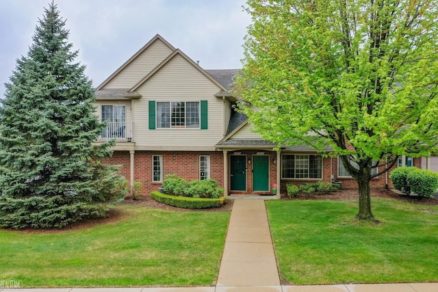 45537 Hidden View Ct, Utica, MI 48315 - traditional-style house with brick siding, a front lawn, and roof with shingles