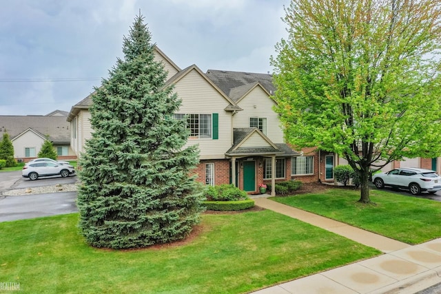 45537 Hidden View Ct, Utica, MI 48315 - view of front facade featuring brick siding and a front lawn