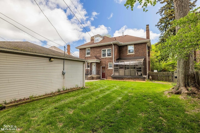1435 Kensington Ave, Grosse Pointe Park, MI 48230 - back of house with a sunroom, a chimney, and brick siding
