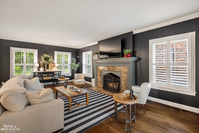1435 Kensington Ave, Grosse Pointe Park, MI 48230 - living room featuring wood finished floors, ornamental molding, baseboards, a high end fireplace, and plenty of natural light