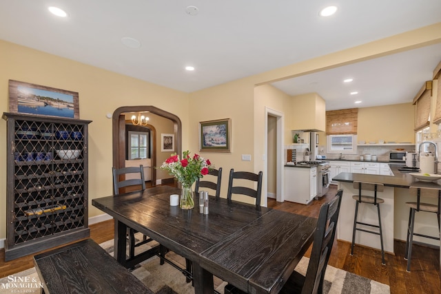 1435 Kensington Ave, Grosse Pointe Park, MI 48230 - dining space featuring recessed lighting, dark wood finished floors, arched walkways, and baseboards