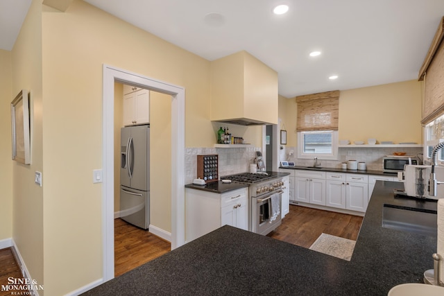 1435 Kensington Ave, Grosse Pointe Park, MI 48230 - kitchen with open shelves, stainless steel appliances, dark countertops, dark wood-style floors, and recessed lighting