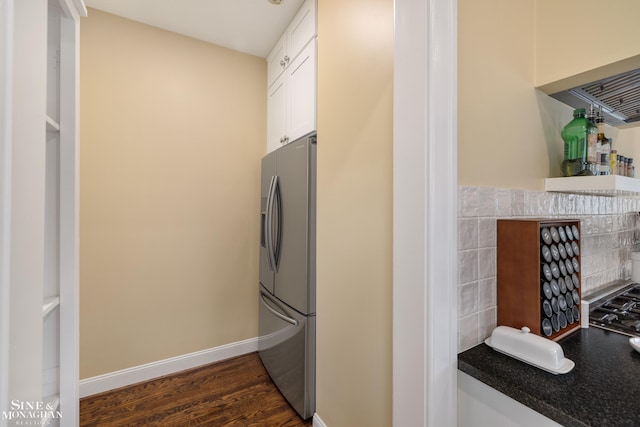 1435 Kensington Ave, Grosse Pointe Park, MI 48230 - kitchen featuring stainless steel refrigerator with ice dispenser, dark countertops, white cabinets, dark wood-type flooring, and baseboards