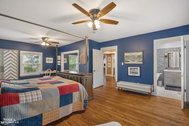 1435 Kensington Ave, Grosse Pointe Park, MI 48230 - bedroom featuring wood finished floors, a ceiling fan, baseboards, and connected bathroom