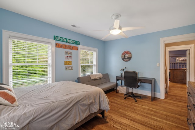1435 Kensington Ave, Grosse Pointe Park, MI 48230 - bedroom with wood finished floors, baseboards, and a ceiling fan