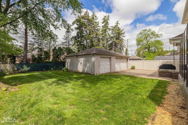 1435 Kensington Ave, Grosse Pointe Park, MI 48230 - view of yard featuring an outbuilding, a garage, and a patio