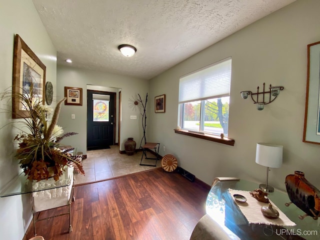 101-103 Juliet St, Marquette, MI 49855 - entryway with a textured ceiling, wood finished floors, and baseboards