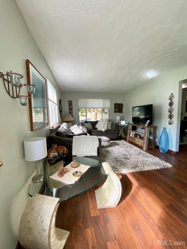 101-103 Juliet St, Marquette, MI 49855 - living area with a textured ceiling and wood finished floors