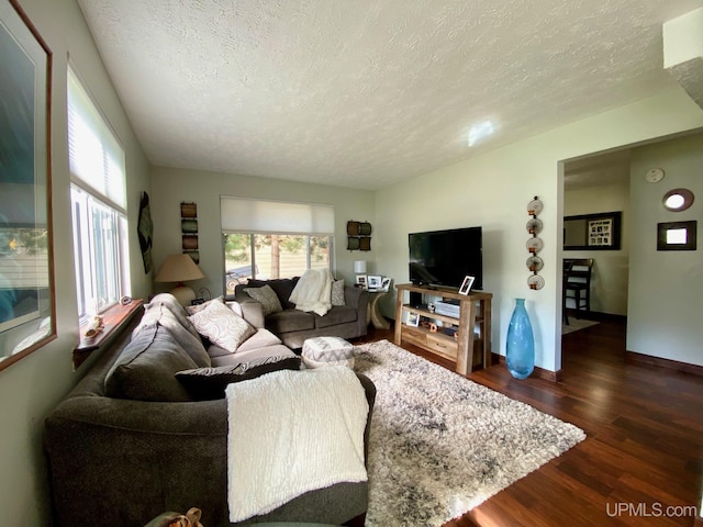 101-103 Juliet St, Marquette, MI 49855 - living room featuring a textured ceiling, dark wood-style floors, and baseboards
