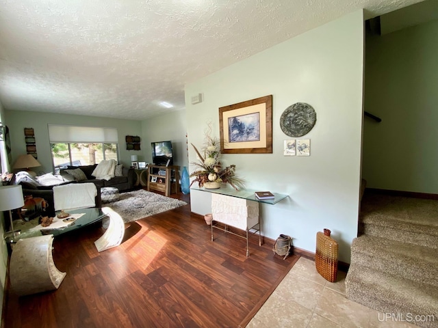 101-103 Juliet St, Marquette, MI 49855 - living area with a textured ceiling and baseboards