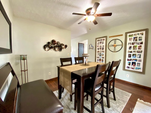 101-103 Juliet St, Marquette, MI 49855 - dining space with a ceiling fan, wood finished floors, a textured ceiling, and baseboards
