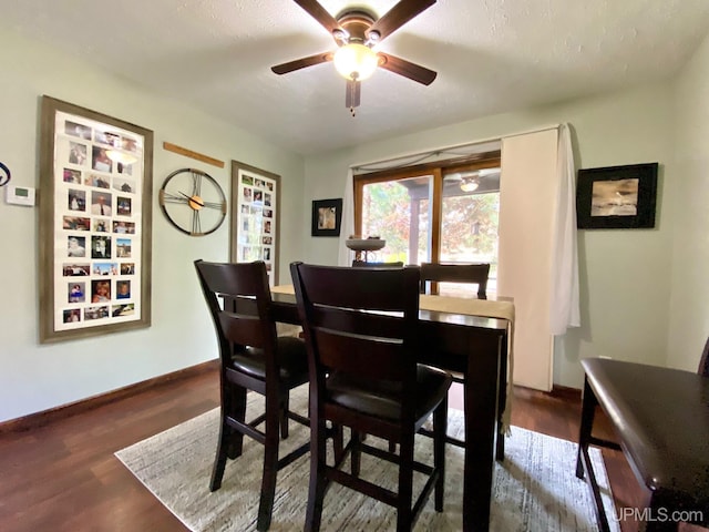 101-103 Juliet St, Marquette, MI 49855 - dining room featuring a ceiling fan, dark wood finished floors, and baseboards
