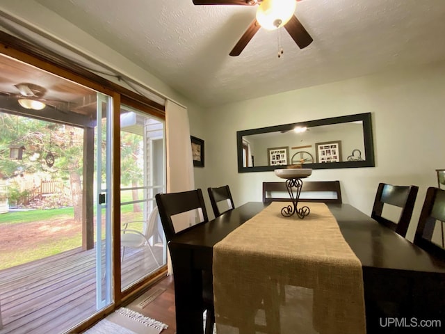 101-103 Juliet St, Marquette, MI 49855 - dining space featuring ceiling fan and a textured ceiling