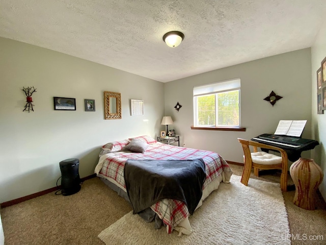 101-103 Juliet St, Marquette, MI 49855 - bedroom with carpet floors, baseboards, and a textured ceiling