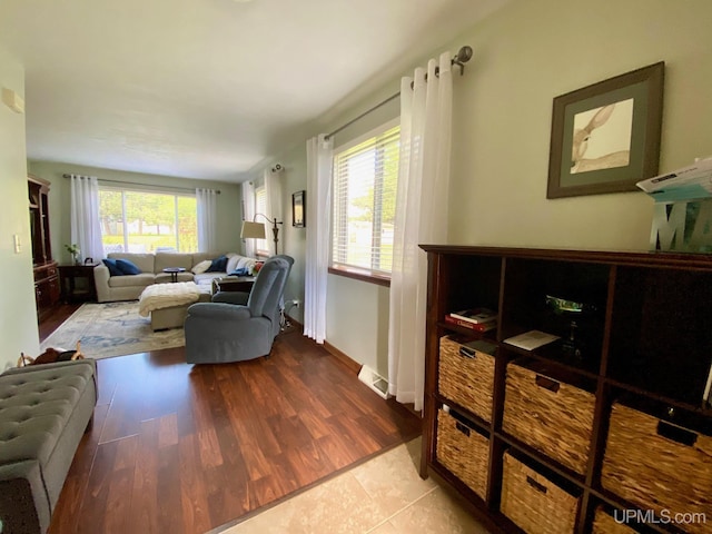 101-103 Juliet St, Marquette, MI 49855 - living room featuring healthy amount of natural light, wood finished floors, and baseboards