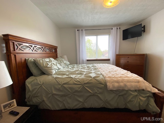 101-103 Juliet St, Marquette, MI 49855 - bedroom featuring a textured ceiling
