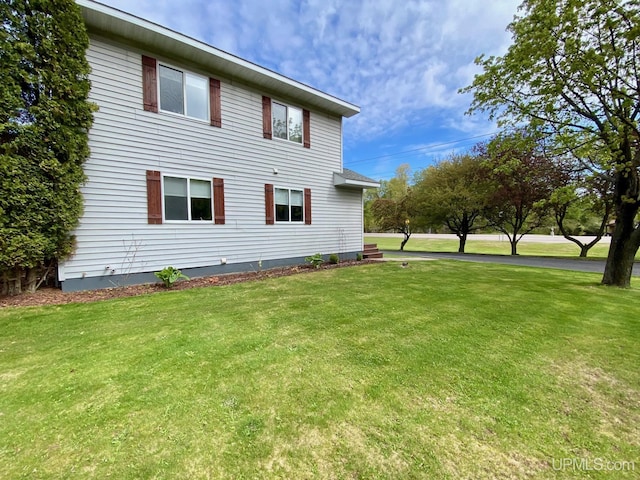 101-103 Juliet St, Marquette, MI 49855 - view of property exterior featuring a lawn