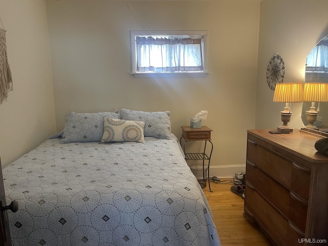513 Neidhold Ave, Wakefield, MI 49968 - bedroom featuring light wood-type flooring and baseboards