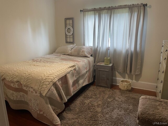 513 Neidhold Ave, Wakefield, MI 49968 - bedroom with baseboards and wood finished floors