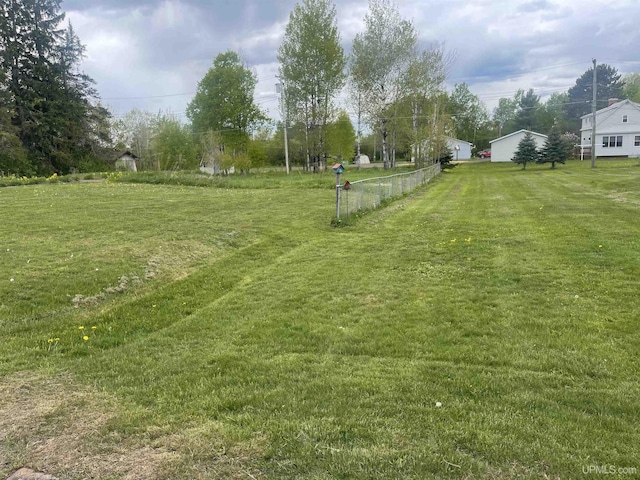 513 Neidhold Ave, Wakefield, MI 49968 - view of grassy yard featuring a garage