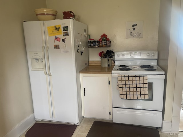 513 Neidhold Ave, Wakefield, MI 49968 - kitchen with white appliances, white cabinetry, and light countertops