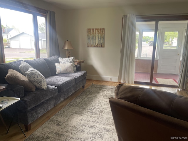 513 Neidhold Ave, Wakefield, MI 49968 - living room with healthy amount of natural light, wood finished floors, and baseboards