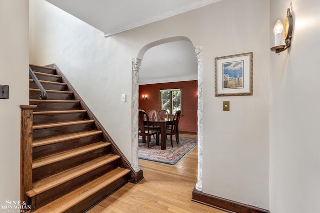 1264 Bedford Rd, Grosse Pointe Park, MI 48230 - stairway with arched walkways and hardwood / wood-style floors