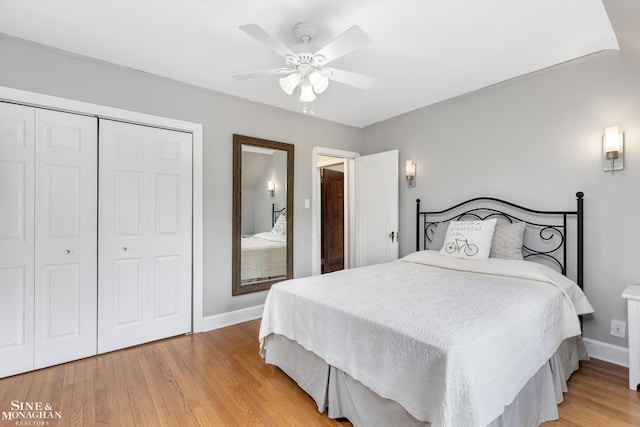 1264 Bedford Rd, Grosse Pointe Park, MI 48230 - bedroom featuring baseboards, a closet, light wood-type flooring, and a ceiling fan