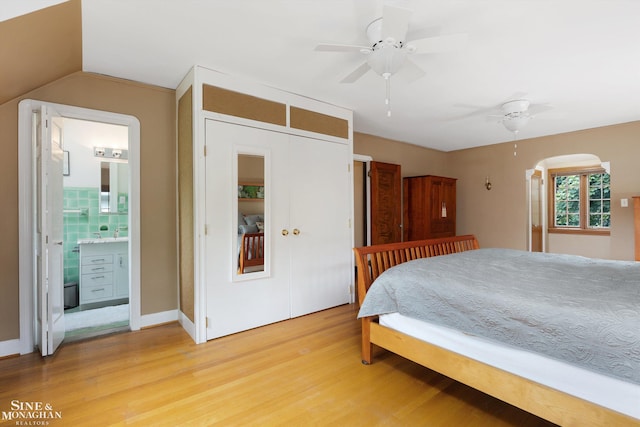 1264 Bedford Rd, Grosse Pointe Park, MI 48230 - bedroom with light wood-style floors, ensuite bath, ceiling fan, and vaulted ceiling