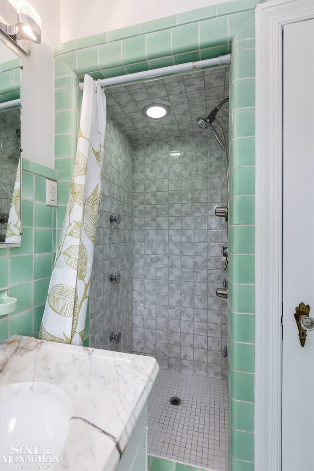 1264 Bedford Rd, Grosse Pointe Park, MI 48230 - full bathroom featuring a stall shower, vanity, and tile walls