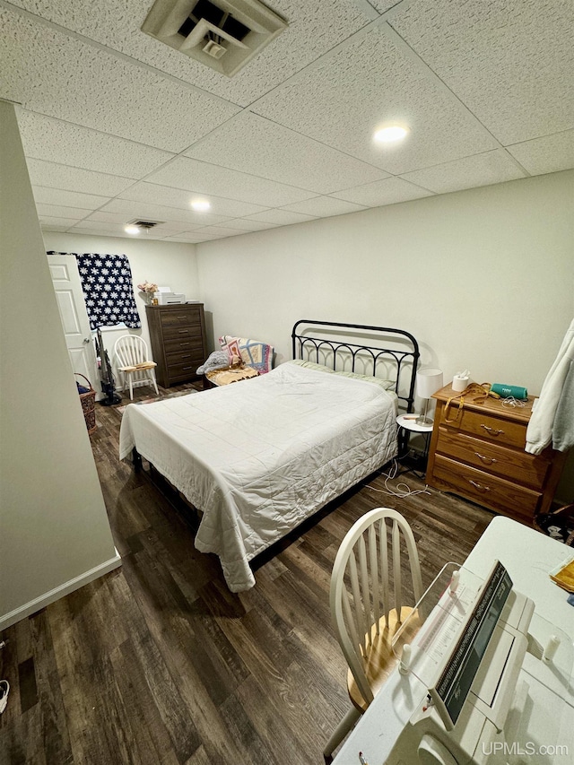 200 Marquette St, Negaunee, MI 49866 - bedroom with a paneled ceiling, wood finished floors, and baseboards