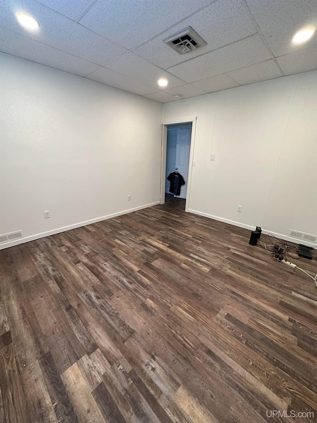 200 Marquette St, Negaunee, MI 49866 - spare room featuring dark wood-style floors, baseboards, and a drop ceiling