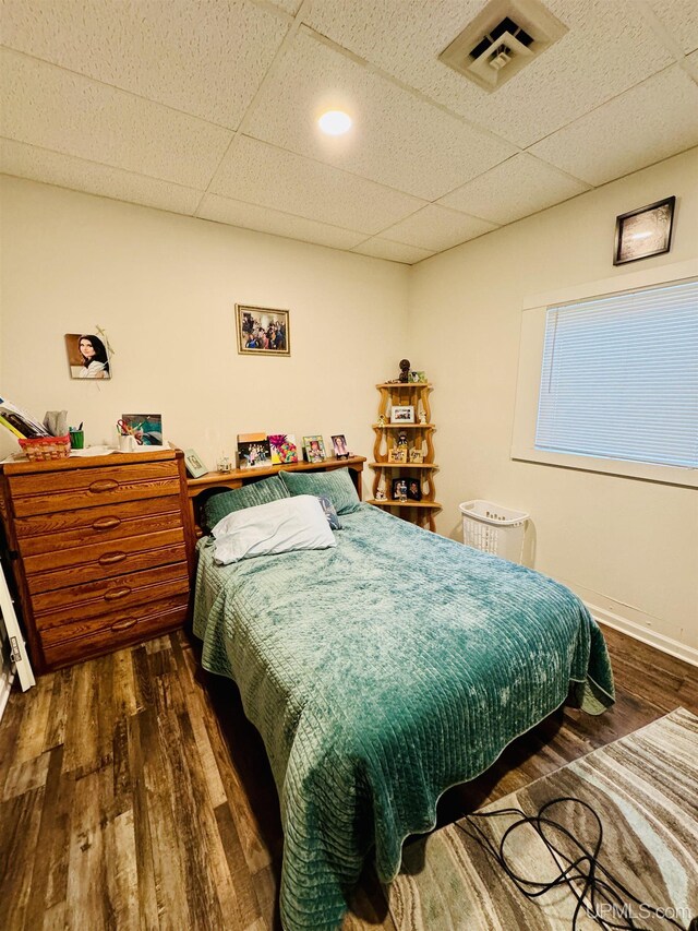 200 Marquette St, Negaunee, MI 49866 - bedroom featuring wood finished floors and a drop ceiling