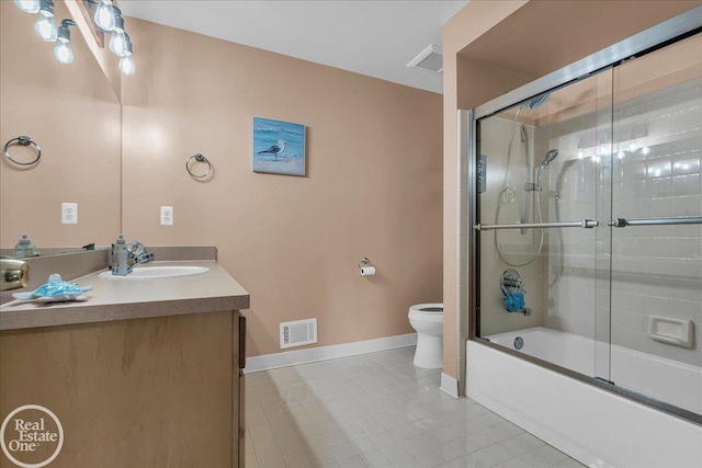 49204 Stratford Dr, Chesterfield Twp, MI 48047 - full bath featuring toilet, vanity, baseboards, tile patterned floors, and enclosed tub / shower combo