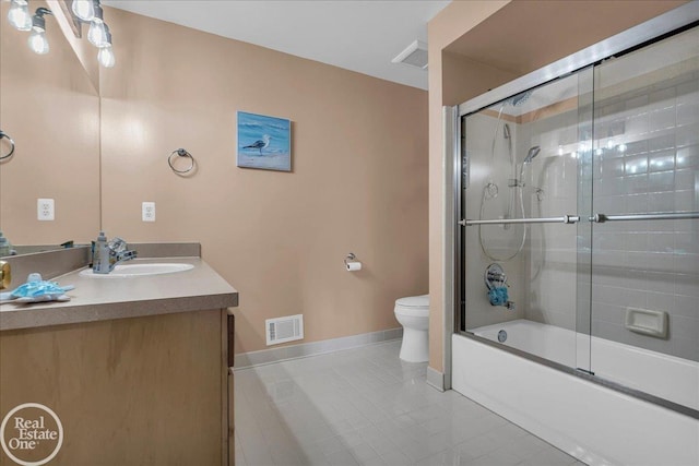 49204 Stratford Dr, Chesterfield Twp, MI 48047 - full bathroom with baseboards, toilet, vanity, tile patterned floors, and bath / shower combo with glass door