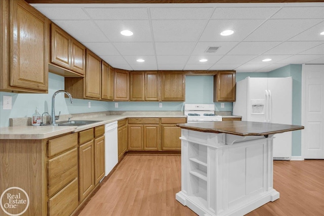 49204 Stratford Dr, Chesterfield Twp, MI 48047 - kitchen featuring white appliances, a sink, light wood-type flooring, open shelves, and recessed lighting